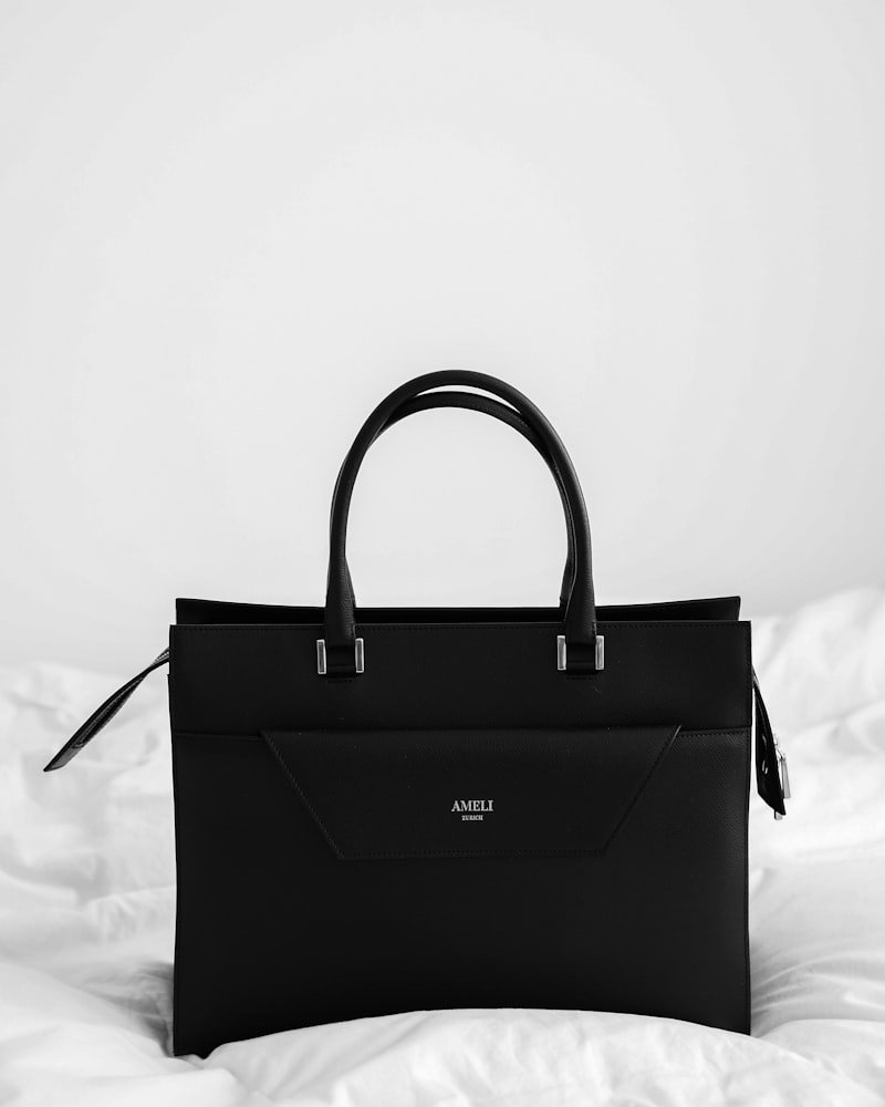 Black structured tote bag with twin top handles